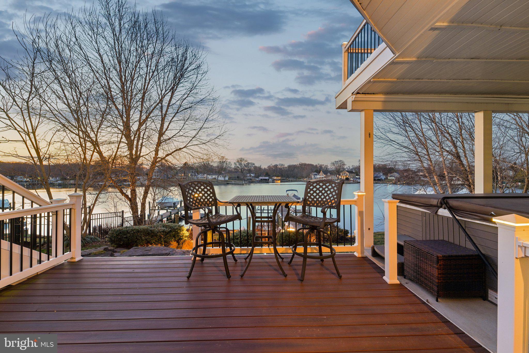 424 Katherine Avenue Baltimore, MD 21221 - Photo 63 of 77 a view of a chairs and table on the wooden deck