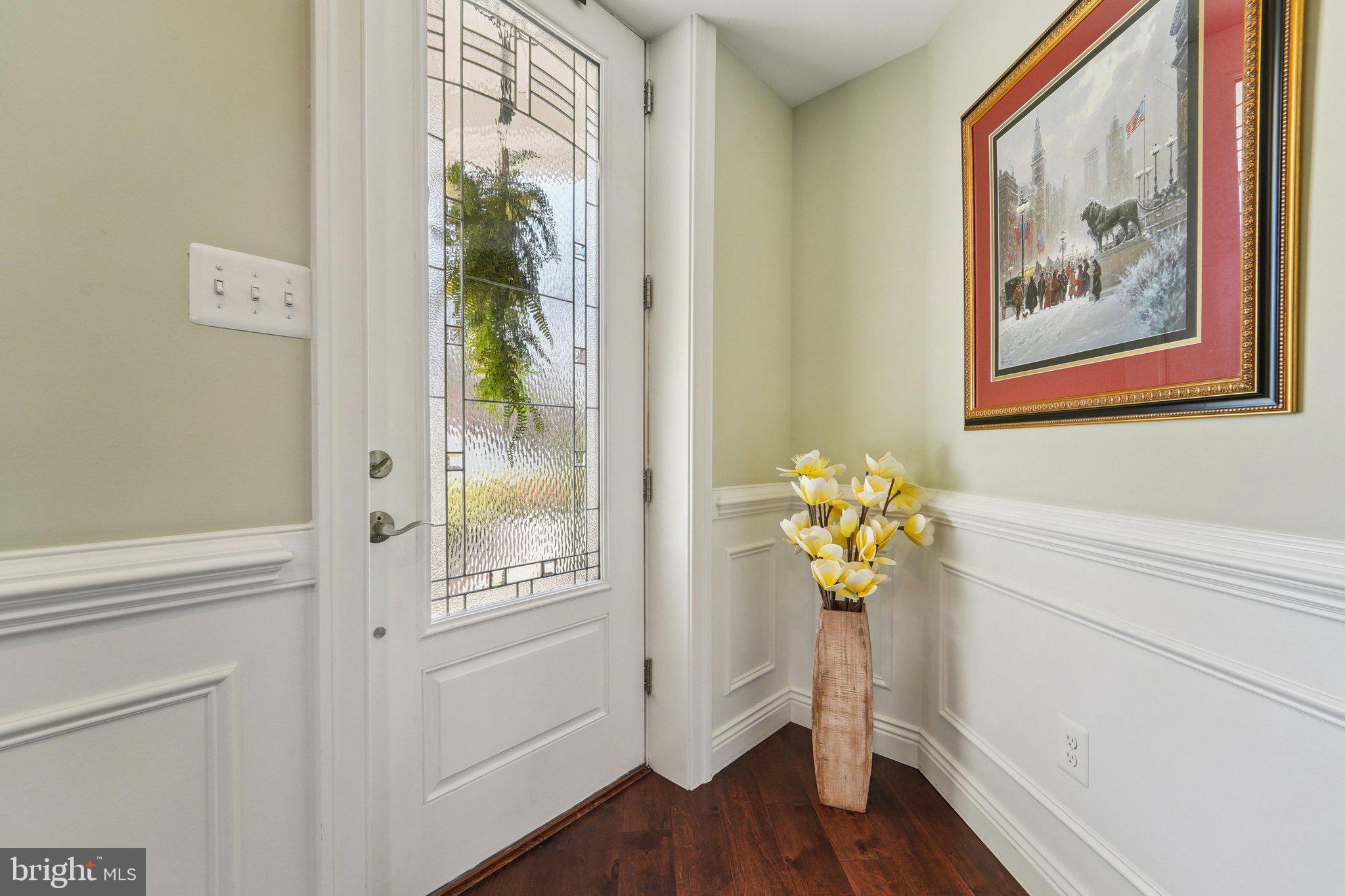 424 Katherine Avenue Baltimore, MD 21221 - Photo 8 of 77 a view of a hallway with wooden floor and a dining room