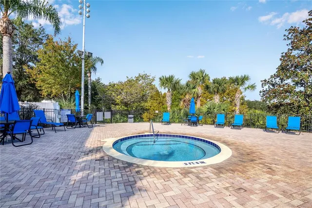 a view of a swimming pool with a patio