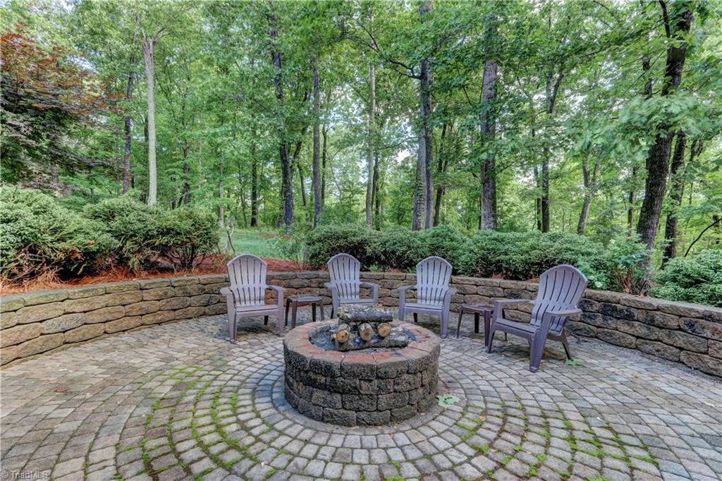 8526 Rosedale Drive Oak Ridge, NC 27310 - Photo 26 of 30 Fire pit area