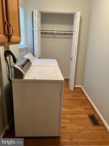 a utility room with washer and dryer