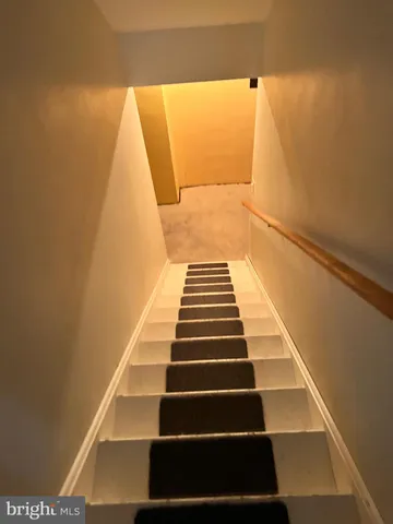 a view of balcony with wooden floor and white walls