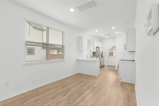 a kitchen with stainless steel appliances granite countertop a sink stove and microwave