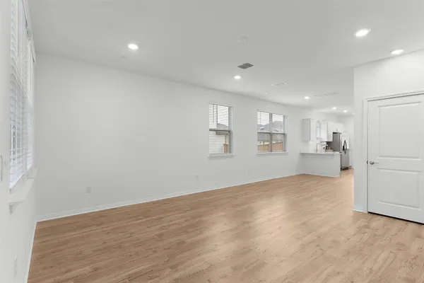 a view of a kitchen with wooden floor