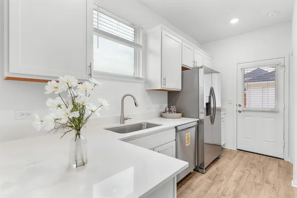 a kitchen with a stove and a microwave