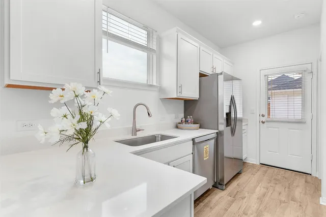 a kitchen with a stove and a microwave