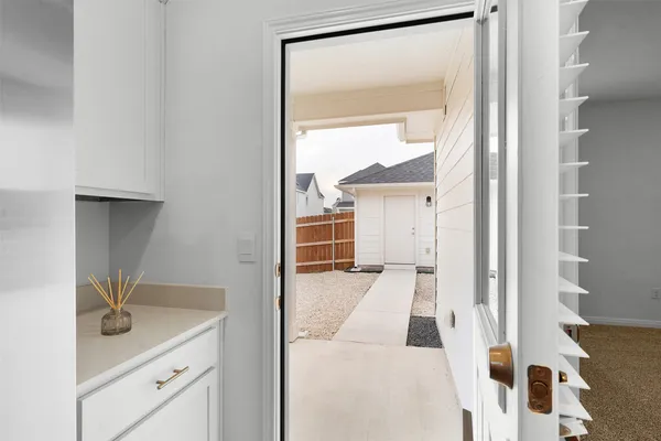 a view of backyard with large tree