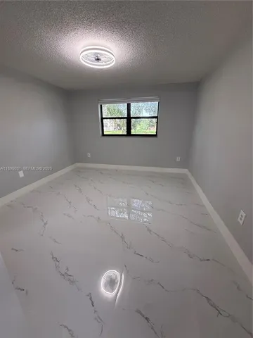 a bathroom with a toilet and a bathtub