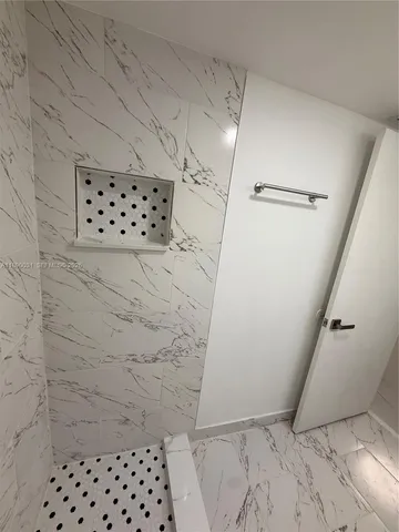 a view of hallway with wooden floor