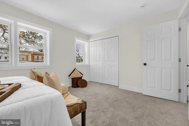 a bedroom with a bed and a cabinets
