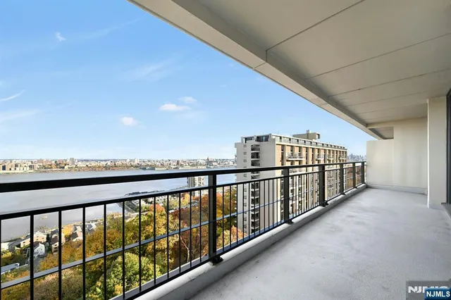 a view of a swimming pool with an outdoor seating