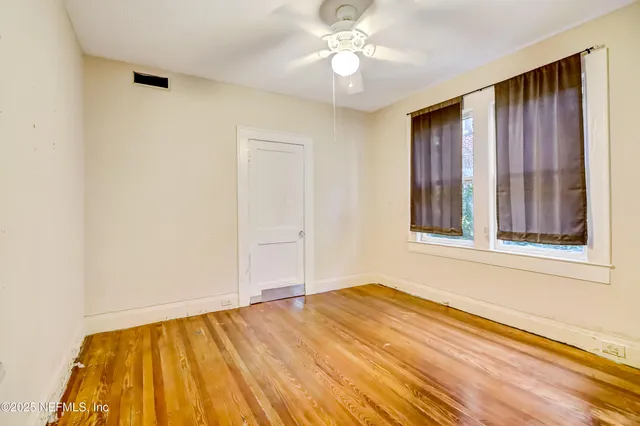 a view of a patio with table and chairs and potted plants