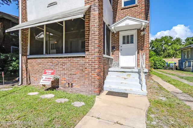 a view of a livingroom with a chandelier fan