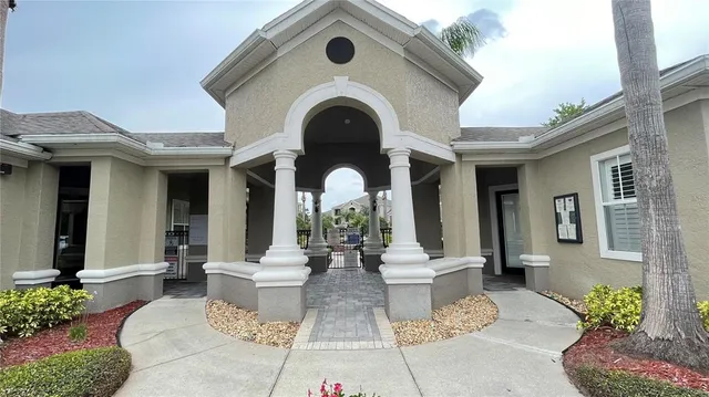 a view of a house with outdoor space porch and furniture