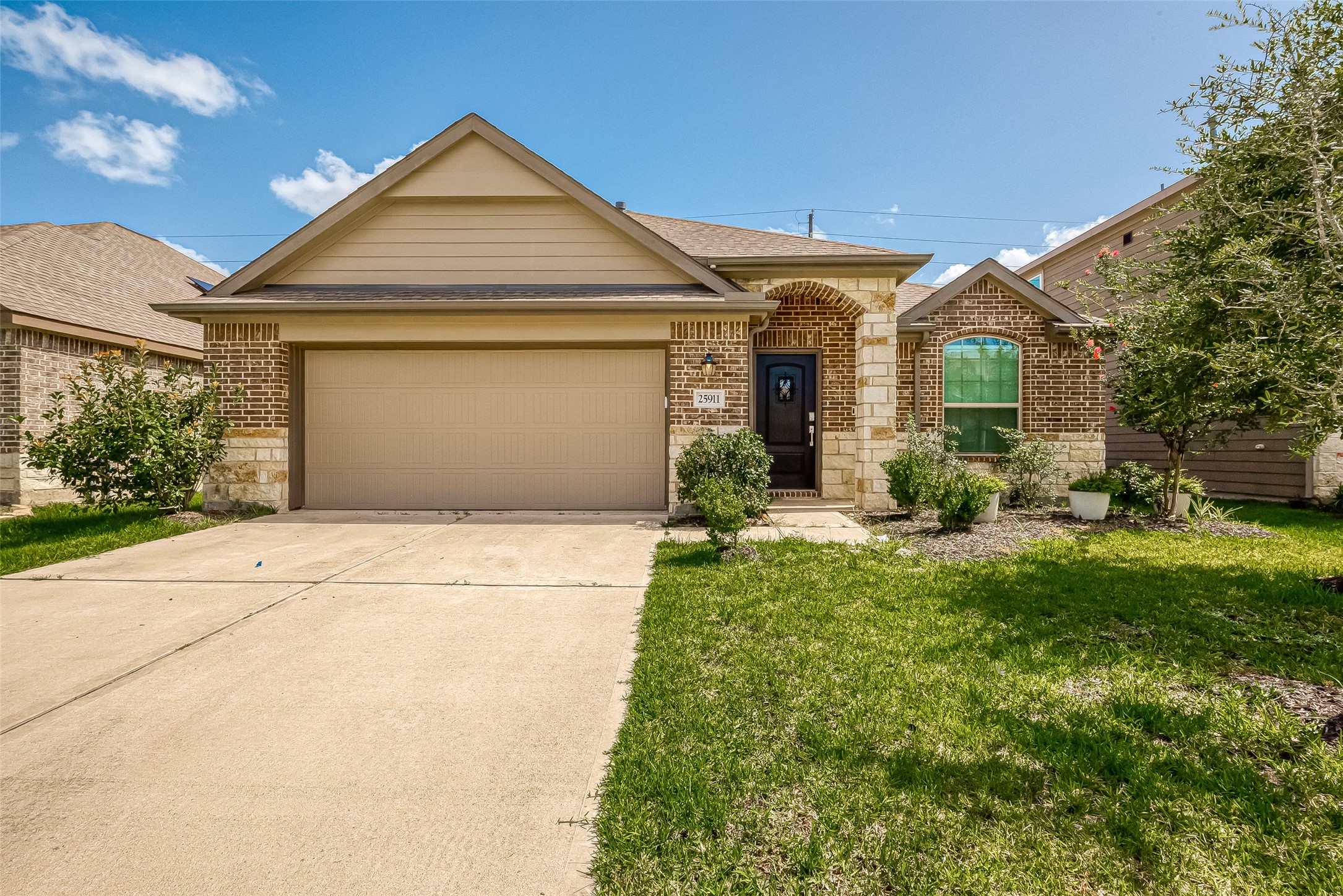 25911 Rustical Road Katy, TX 77493 - Photo 1 of 40 a front view of a house with garden