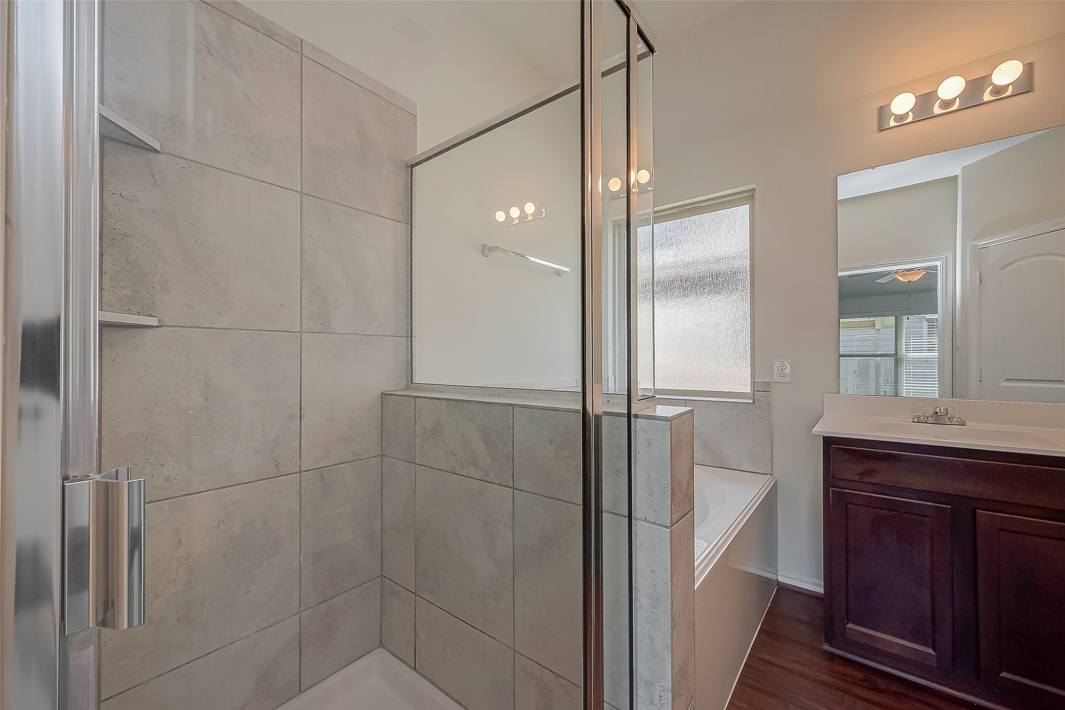 25911 Rustical Road Katy, TX 77493 - Photo 26 of 40 a bathroom with a shower and a sink