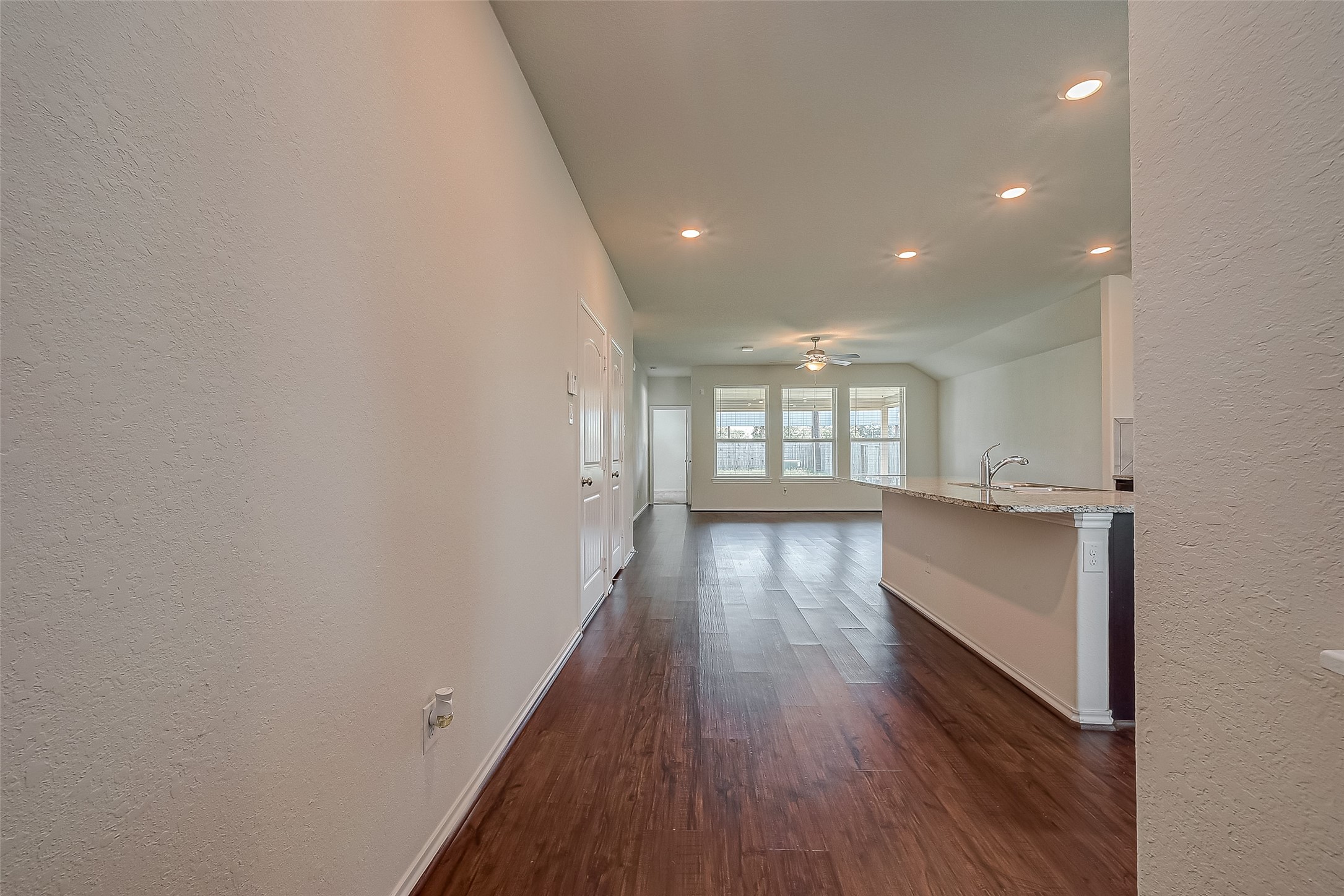 25911 Rustical Road Katy, TX 77493 - Photo 4 of 40 wooden floor in an empty room with a window