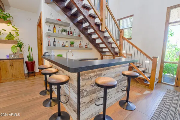 a kitchen with stainless steel appliances granite countertop a stove and a sink