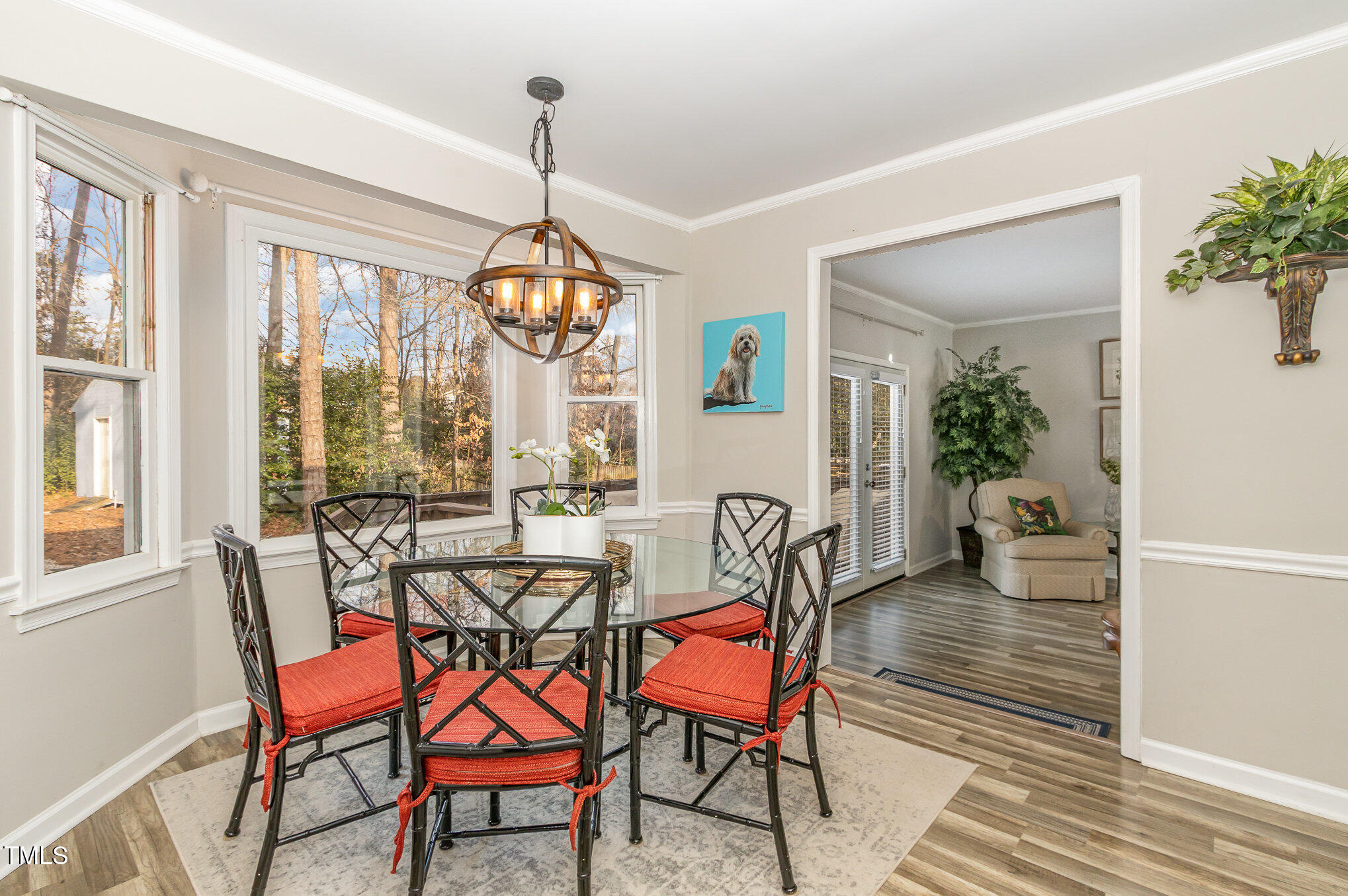 401 Rosehaven Drive Raleigh, NC 27609 - Photo 6 of 26 Dining area has stylish light fixture and bay window