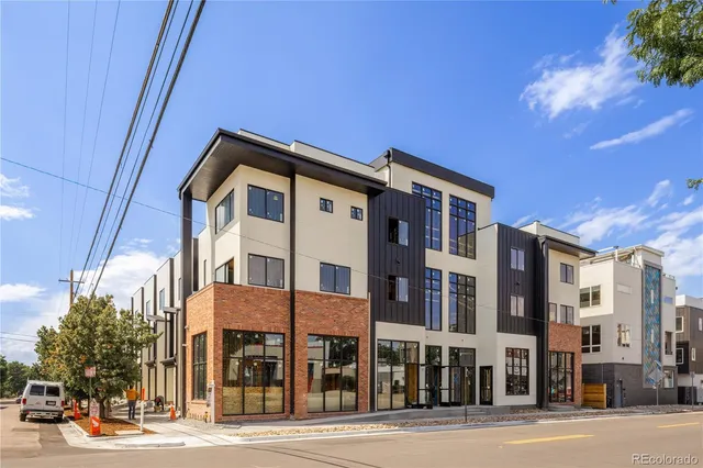 a front view of a building with street view