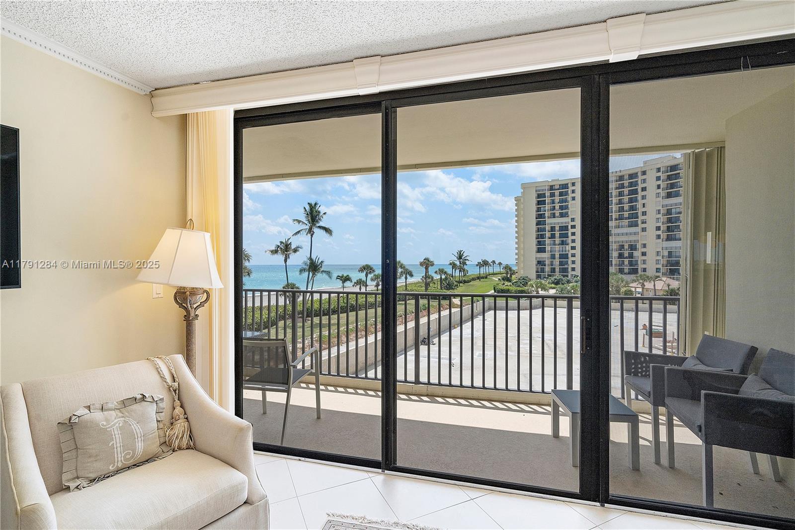400 Ocean Trail Way, Unit 302 Jupiter, FL 33477 - Photo 14 of 34 a view of a living room and floor to ceiling window