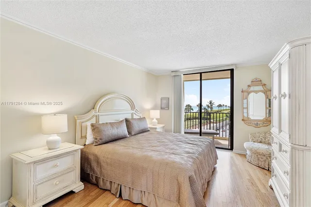 a bedroom with a large bed and a large window