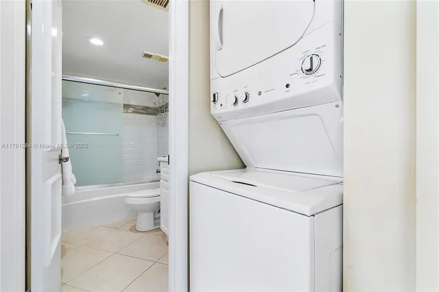 a bathroom with a toilet sink and shower