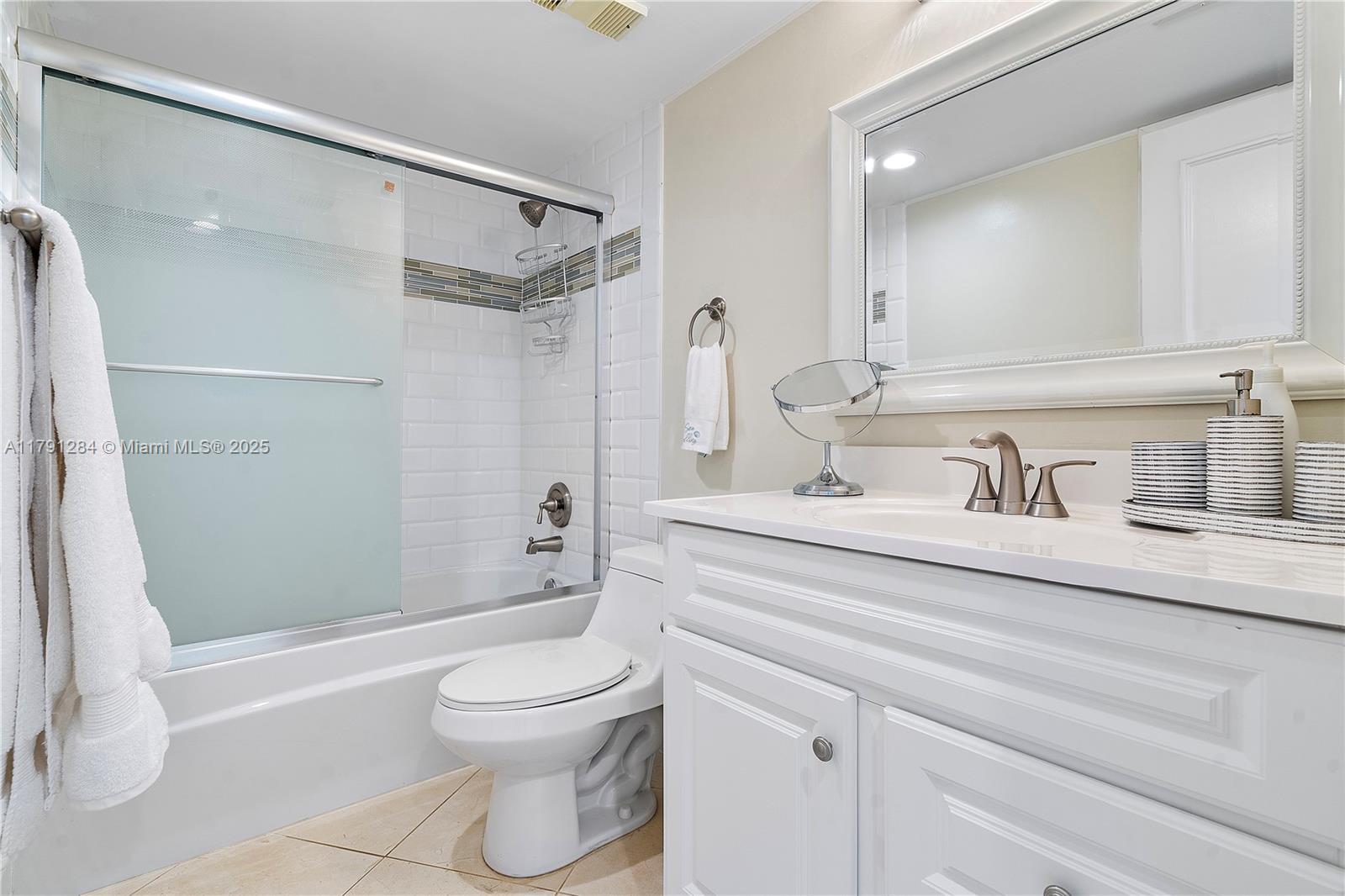 400 Ocean Trail Way, Unit 302 Jupiter, FL 33477 - Photo 23 of 34 a bathroom with a sink toilet and shower