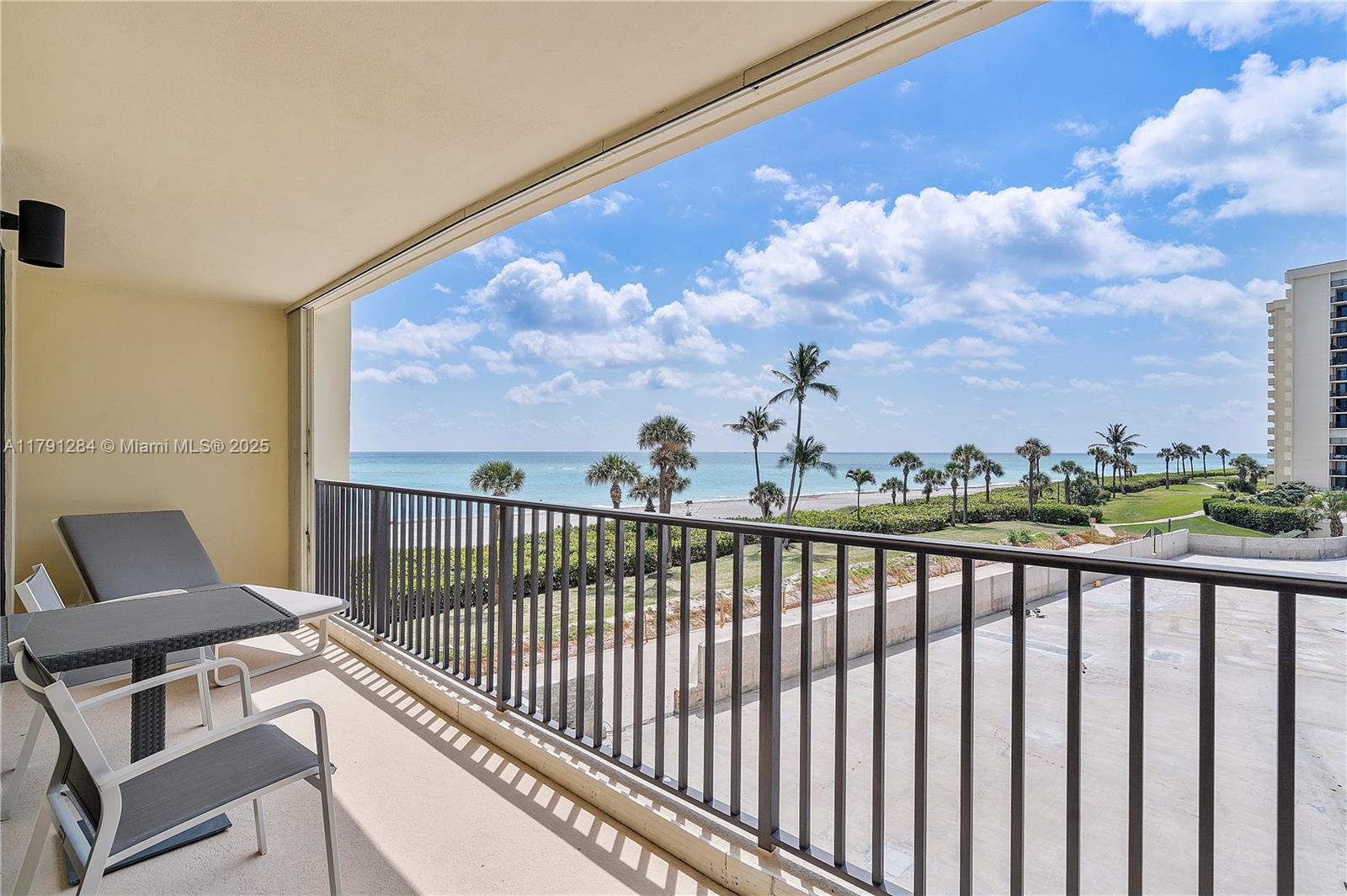 400 Ocean Trail Way, Unit 302 Jupiter, FL 33477 - Photo 24 of 34 a view of a chair and city view