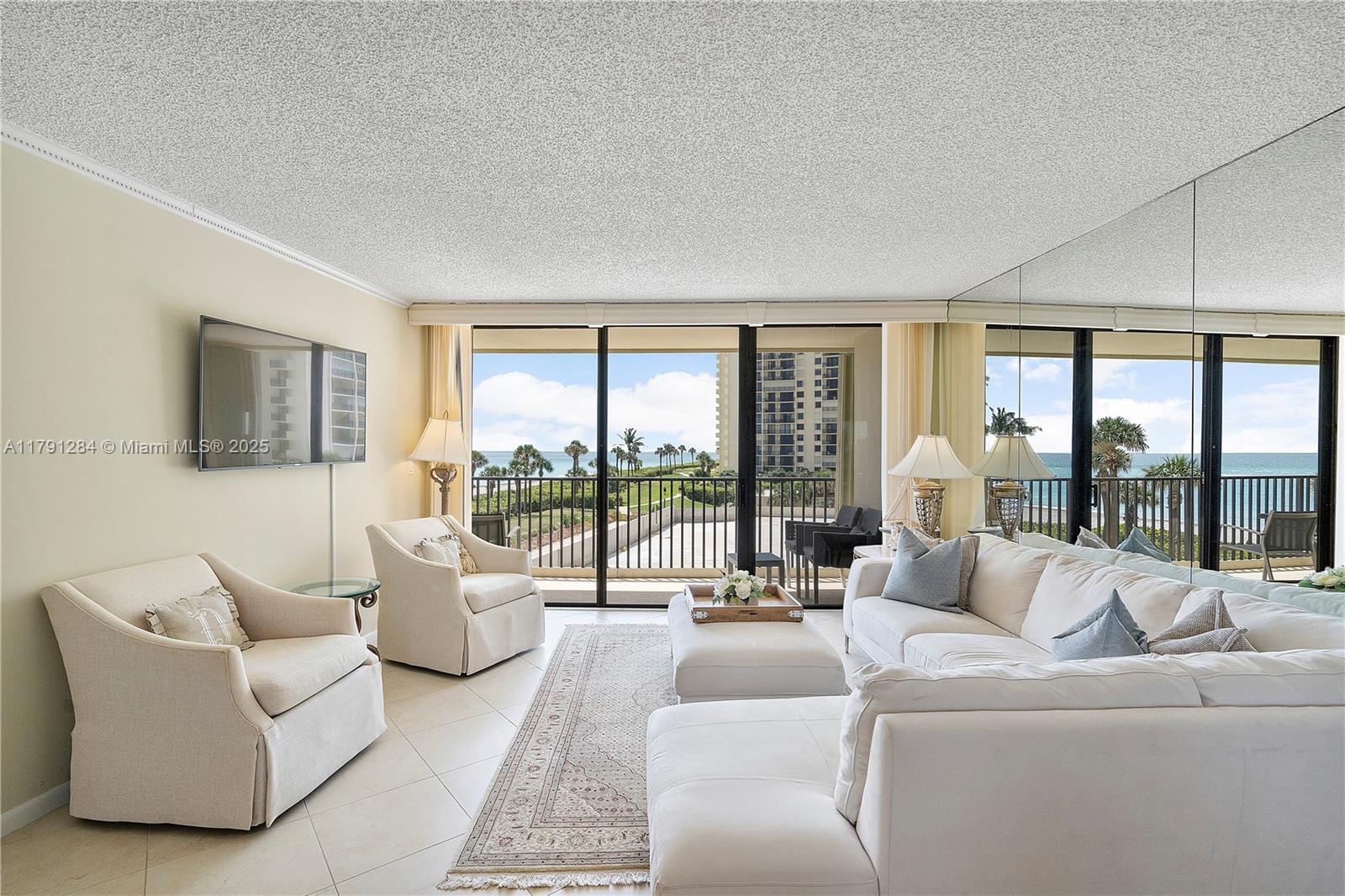 400 Ocean Trail Way, Unit 302 Jupiter, FL 33477 - Photo 3 of 34 a living room with furniture and a large window