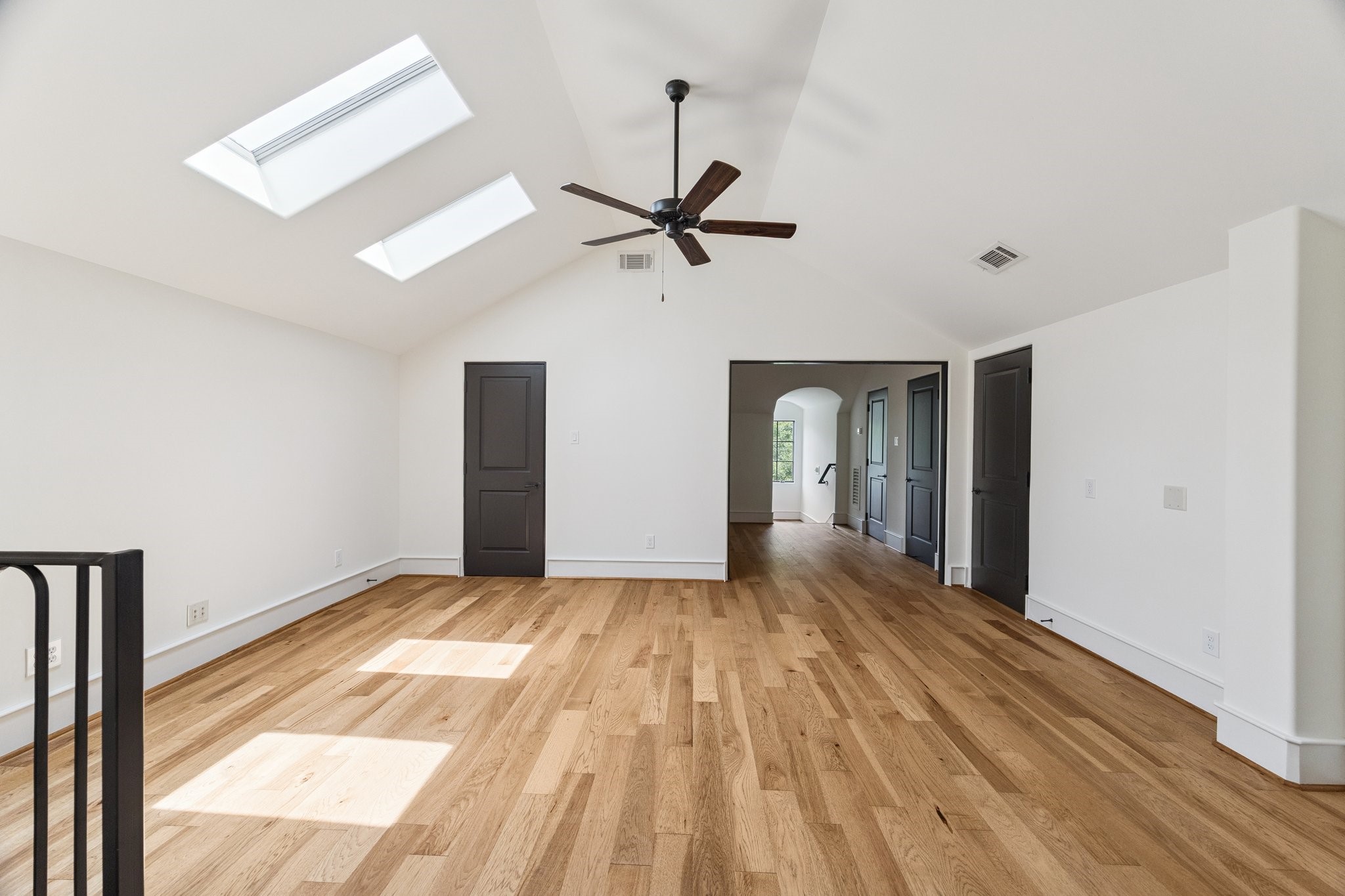 5309 Cherokee Street Houston, TX 77005 - Photo 31 of 40 a view of a room with wooden floor ceiling fan and a window