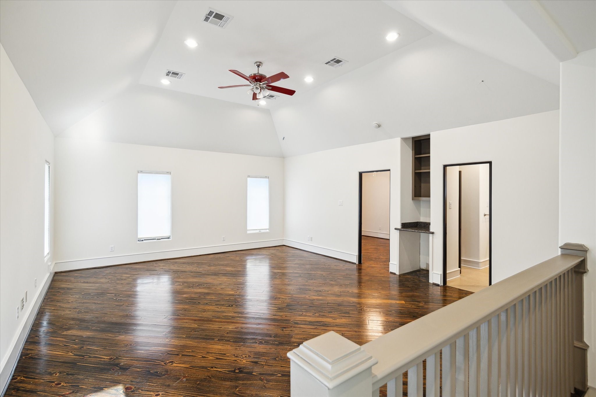 5309 Cherokee Street Houston, TX 77005 - Photo 35 of 40 an empty room with wooden floor and ceiling fan