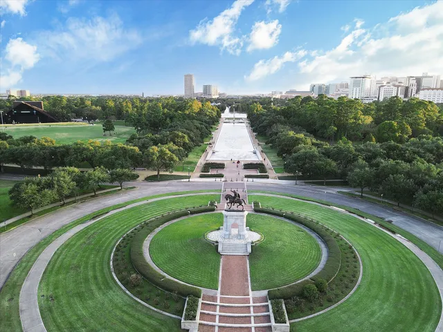 a swimming pool with a yard in back