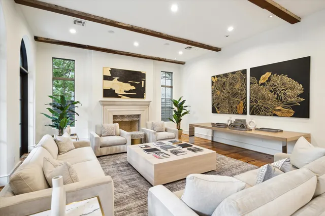 a living room with furniture fireplace and a flat screen tv