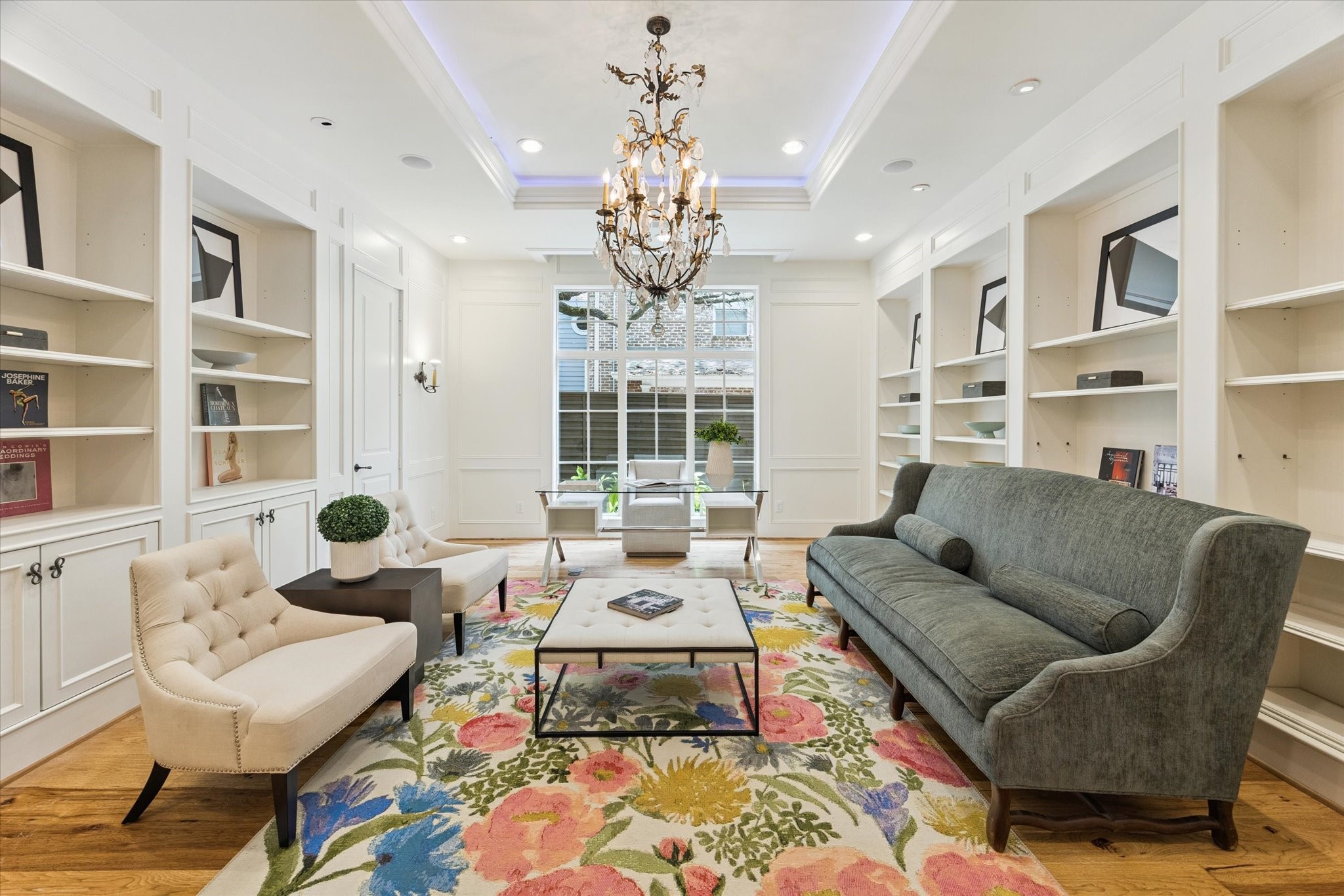5309 Cherokee Street Houston, TX 77005 - Photo 10 of 40 a living room with fireplace furniture and a chandelier