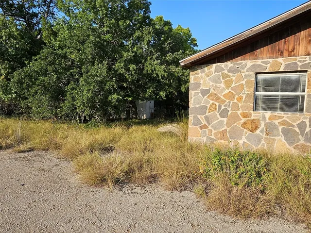 a view of swimming pool next to a yard