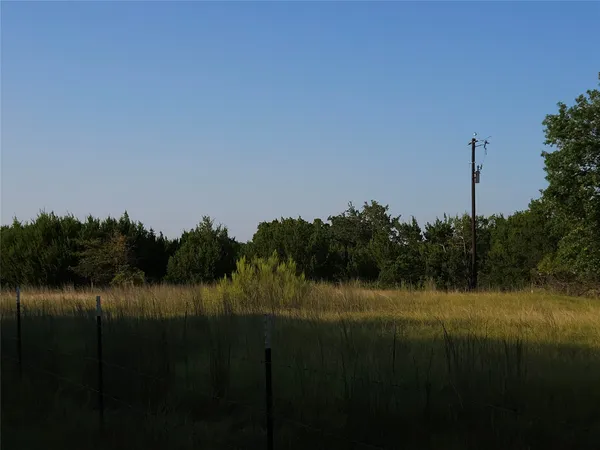 a view of lake with green space