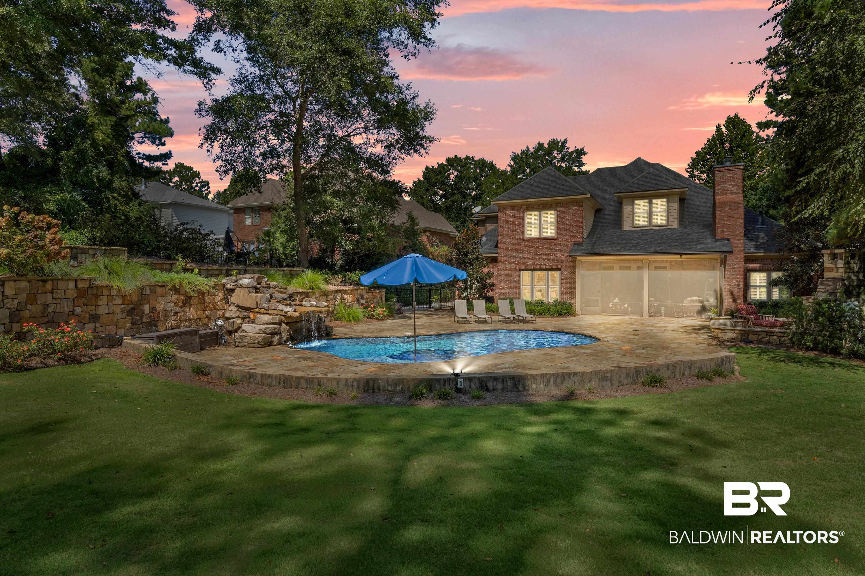 30057 Dolive Ridge Daphne, AL 36527 - Photo 39 of 55 Pool at dusk featuring a yard