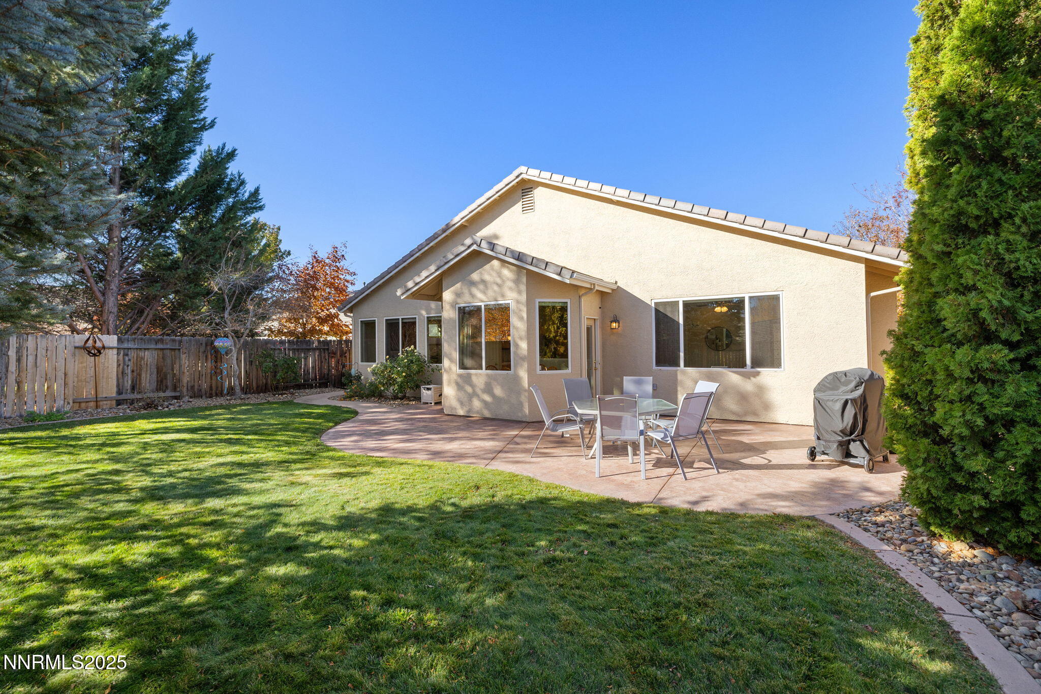 10560 Vista Alta Drive Reno, NV 89521 - Photo 21 of 25 a view of a house with backyard and sitting area