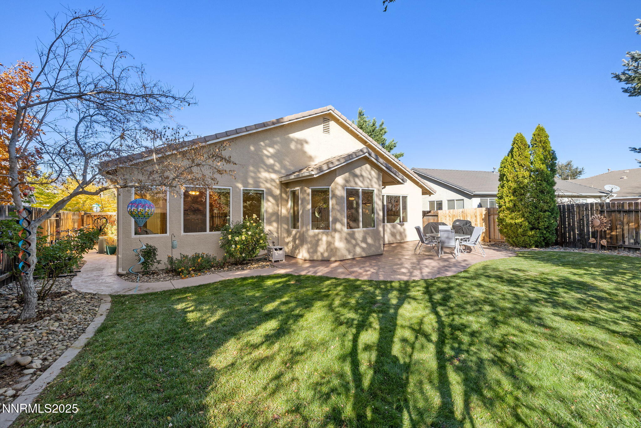 10560 Vista Alta Drive Reno, NV 89521 - Photo 23 of 25 front view of a house with a yard