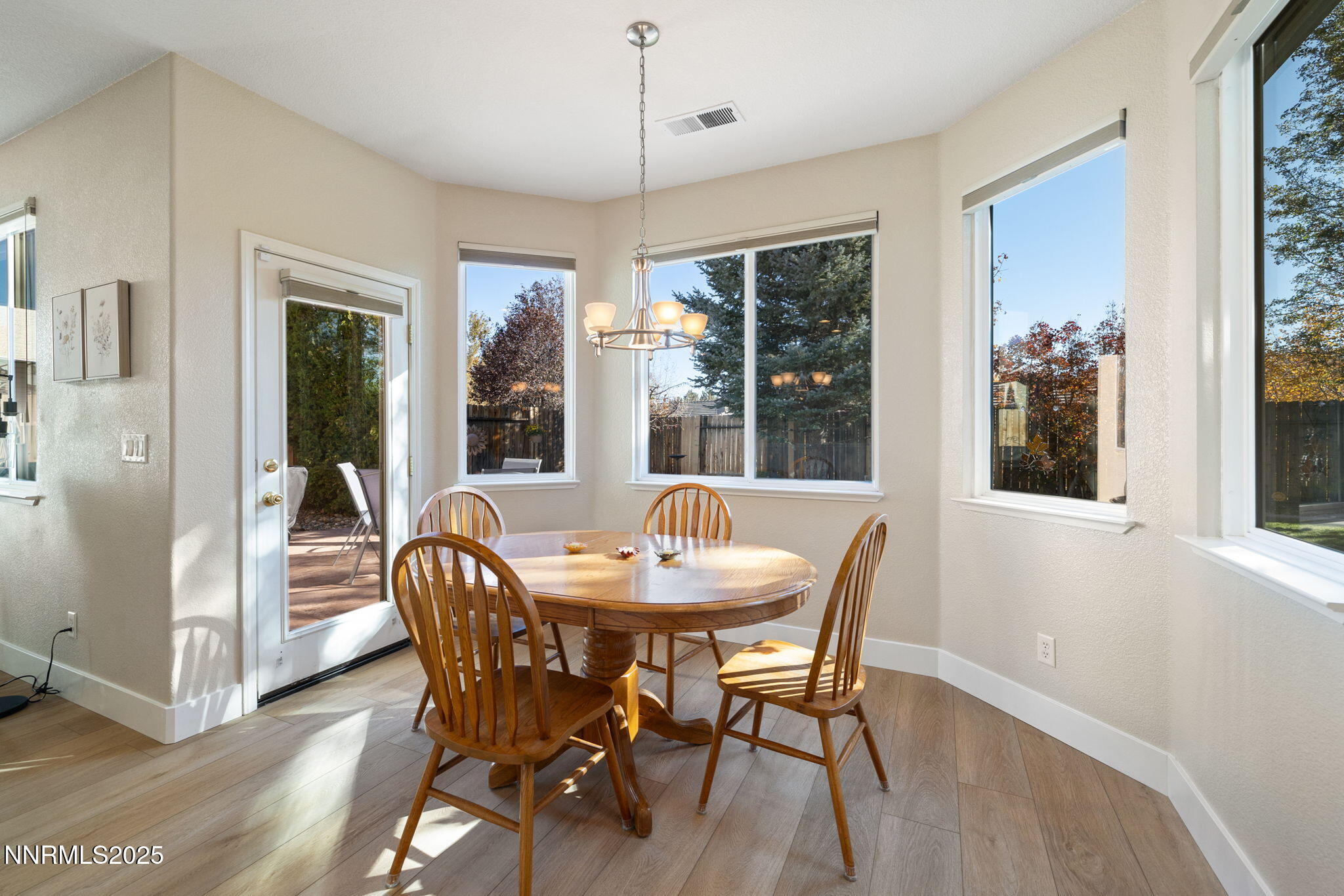 10560 Vista Alta Drive Reno, NV 89521 - Photo 8 of 25 a dining room with furniture window wooden floor