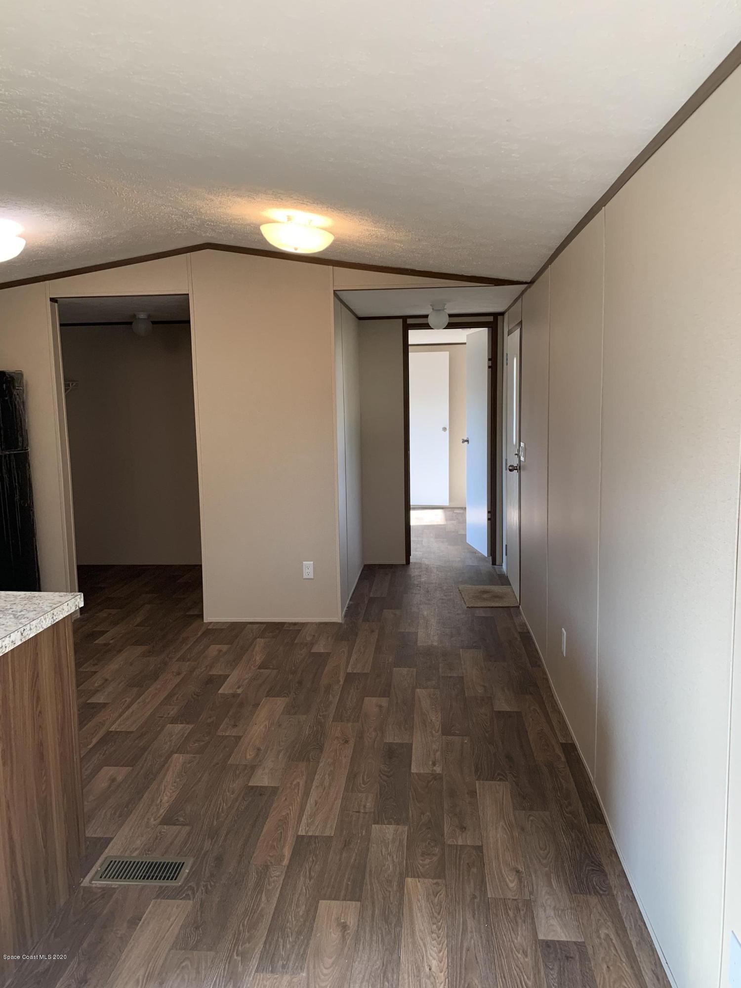 2561 Amberly Road Northeast Palm Bay, FL 32905 - Photo 22 of 28 Hall going towards Master Bdrm