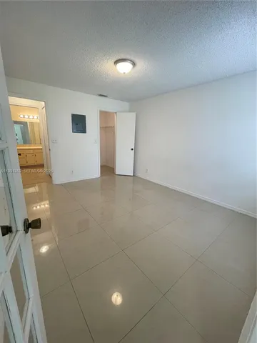 an empty room with a bathroom