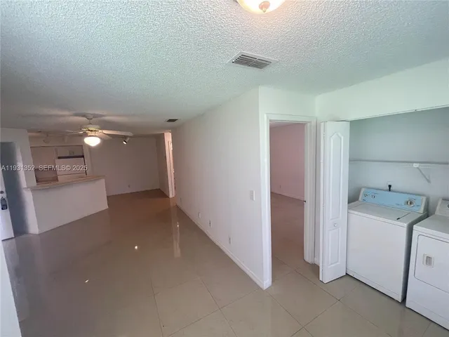 a view of a storage & utility room with a sink