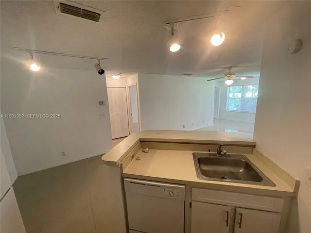 a bathroom with a sink and cabinets