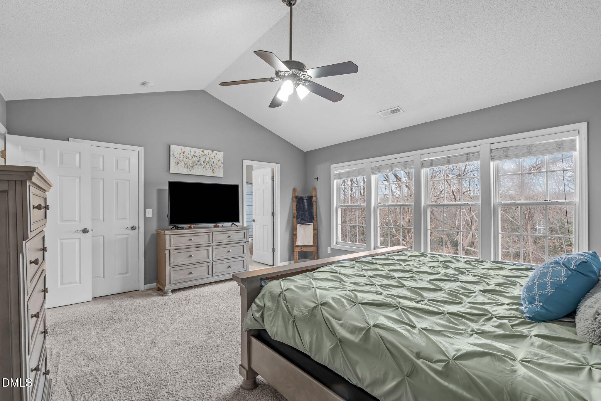 2501 Springfield Park Drive Raleigh, NC 27614 - Photo 33 of 44 a bedroom with a bed and a flat screen tv
