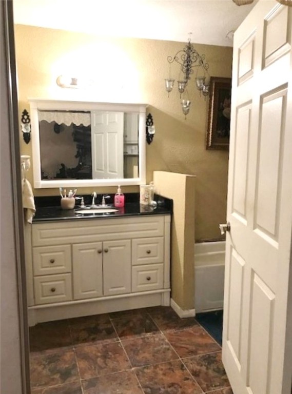 1188 Private 6030 Cameron, TX 76520 - Photo 15 of 28 a spacious bathroom with a double vanity sink a mirror and a shower