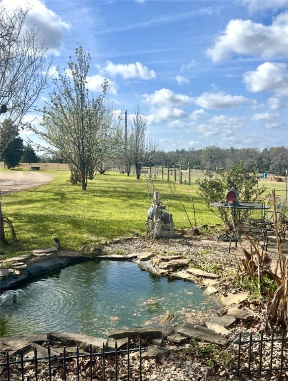 1188 Private 6030 Cameron, TX 76520 - Photo 24 of 28 a view of a lake with a nearby beach