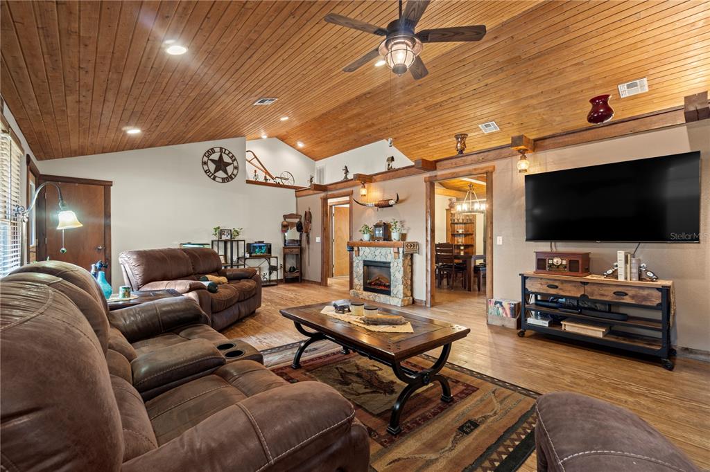 4292 Southwest 73rd Trail Bushnell, FL 33513 - Photo 17 of 88 a living room with furniture and a flat screen tv