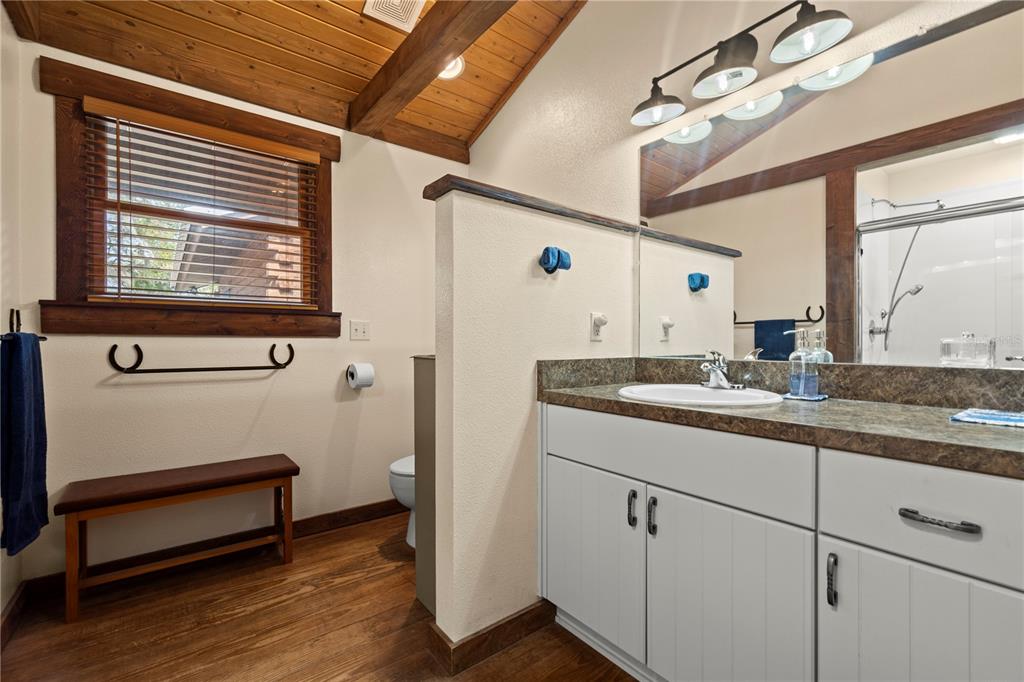 4292 Southwest 73rd Trail Bushnell, FL 33513 - Photo 27 of 88 a bathroom with a sink and a mirror
